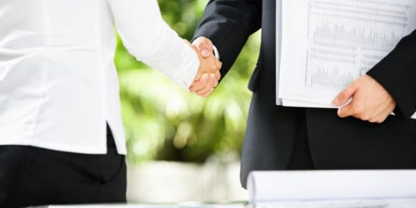 Handshake between businessman and businesswoman E-Waste Recycling